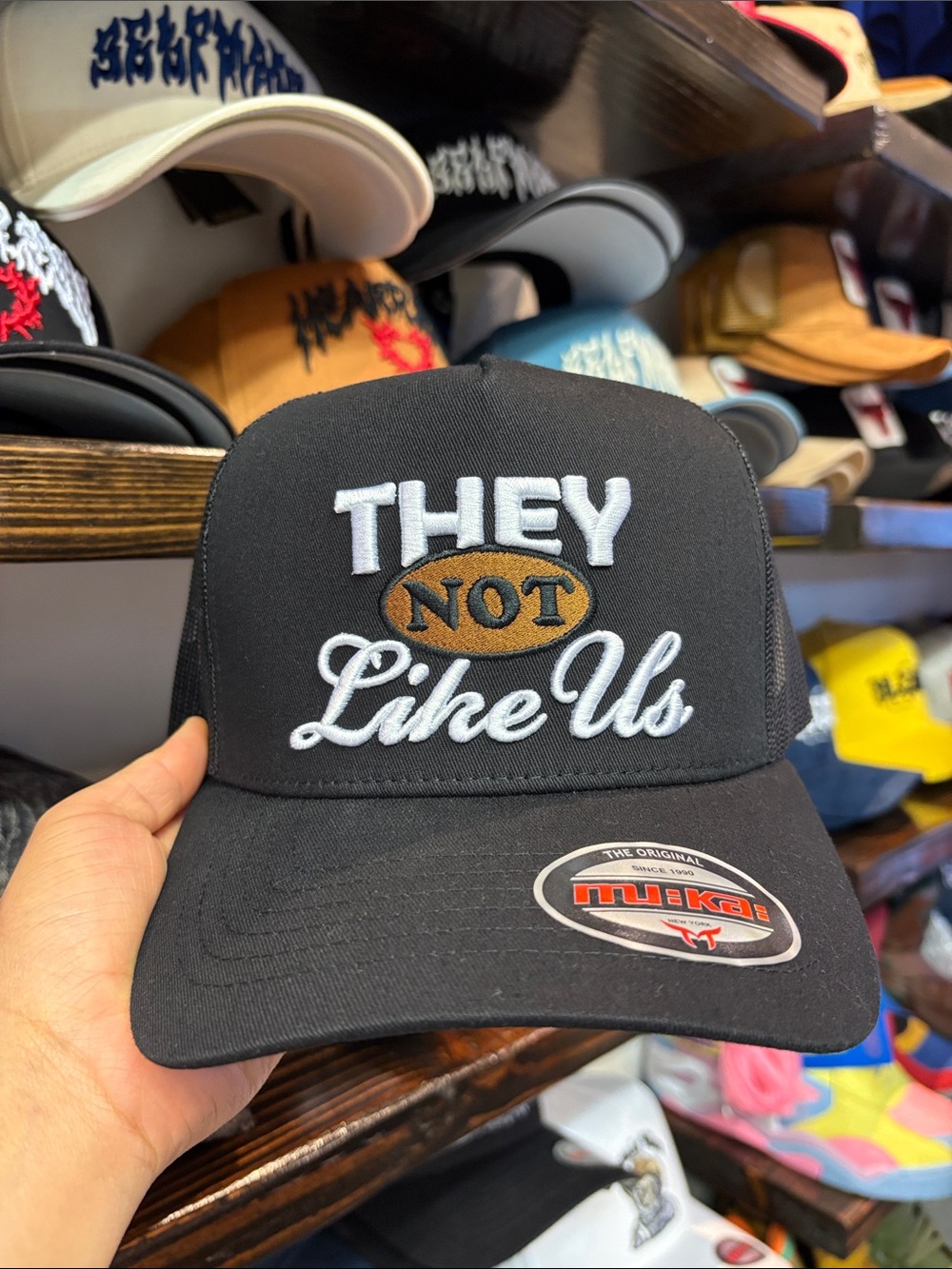 Black 'They Not Like Us' Embroidered Trucker Hat
